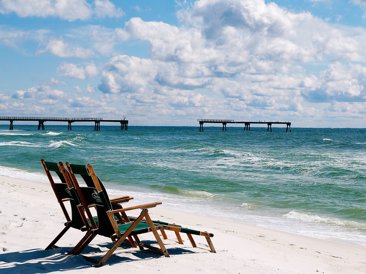 The beach near our Gulf Shores Beachfront Rentals, with two chairs facing the water