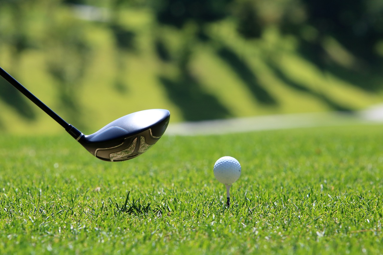 An individual lining up a shot at the Cotton Creek Golf Course