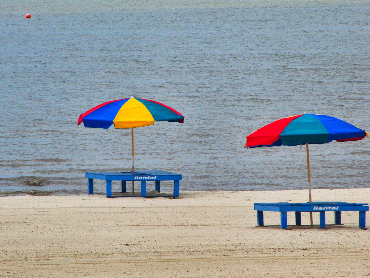 Beach umbrellas over tables on the beach