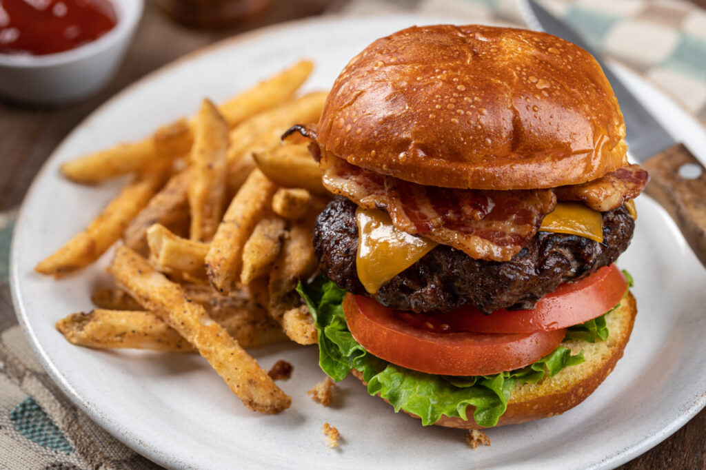 A cheeseburger and fries platter